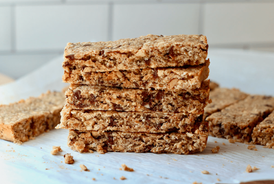 Home 5 Sourdough granola bars stacked on parchment